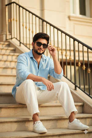Pose Variant 1 – Sitting on Steps Sunglasses Adjustment
